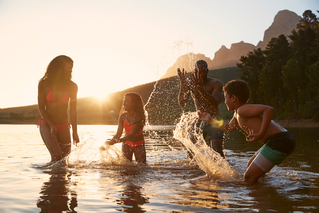 Family Enjoying Evening Swim 